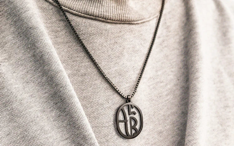 monogram_necklace_man_model_1_1.webp